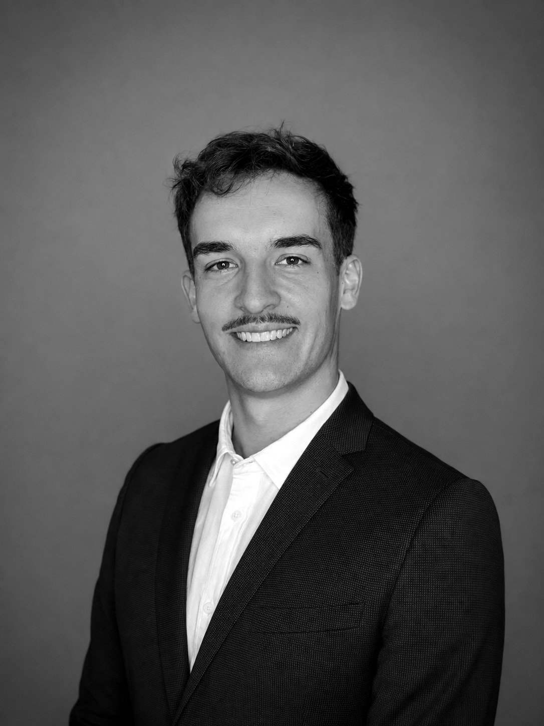 Black-and-white professional portrait of Max Hartwig